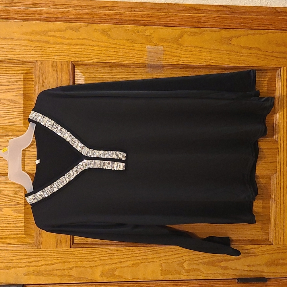 Long sleeve black top with silver sequin V-neck